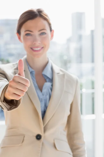 Pretty businesswoman giving thumb up to camera — Stock Photo, Image