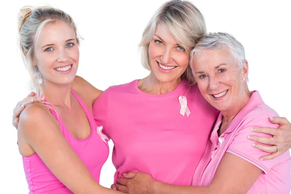 Mujeres con tops rosas y cintas para el cáncer de mama — Foto de Stock