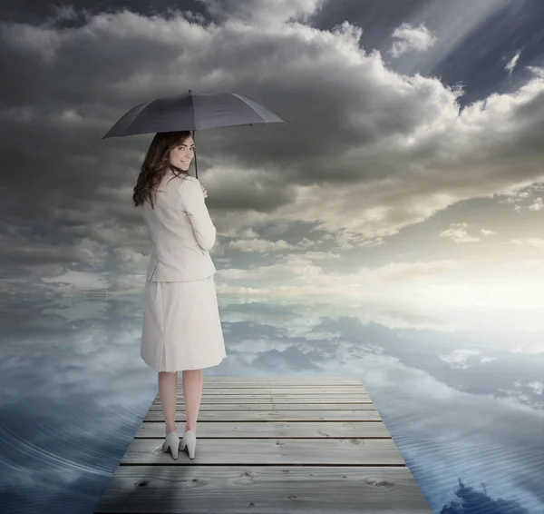 Businesswoman standing on bridge — Stock Photo, Image