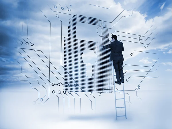 Businessman on a ladder touching a padlock — Stock Photo, Image