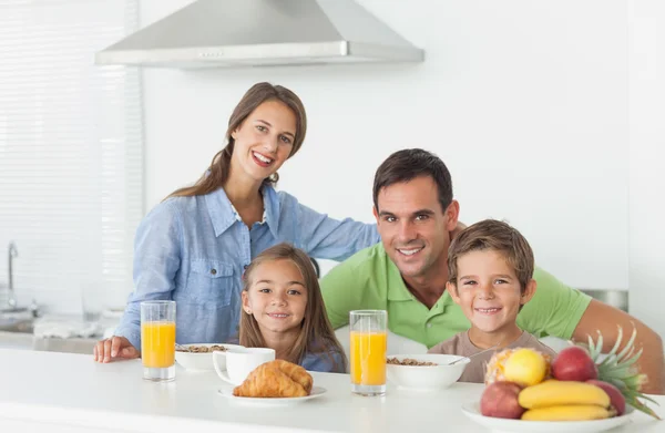Portrait of cute family having breakfast — Stock Photo, Image
