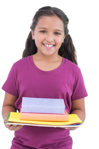 Menina segurando cadernos e livros para sua lição de casa — Fotografia de Stock