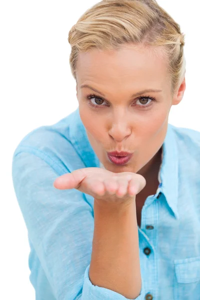 Happy blonde woman blowing kisses Royalty Free Stock Photos