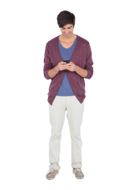 Smiling man looking at his mobile phone clipart