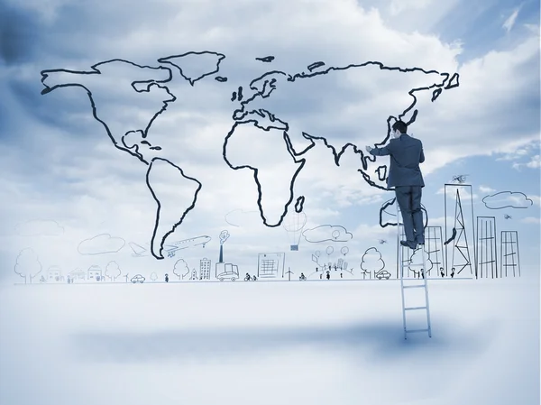 Businessman on a ladder drawing a map — Stock Photo, Image