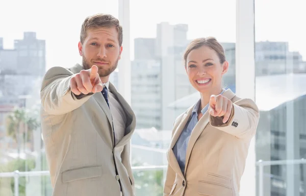 Business team pointing at camera — Stock Photo, Image