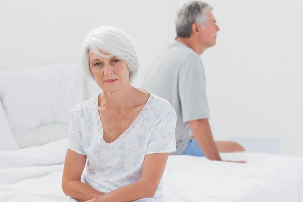 Woman sulking in bed during a conflict — Stock Photo, Image