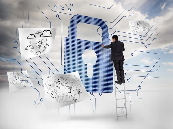 Businessman on a ladder selecting a giant padlock — Stock Photo, Image