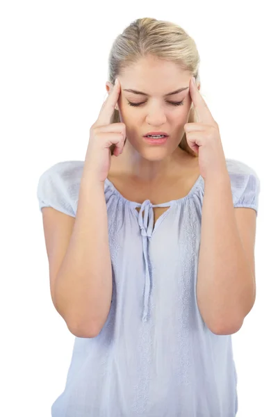 Unsmiling young woman has a headache — Stock Photo, Image