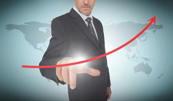 Businessman selecting a red arrow pointing up — Stock Photo, Image