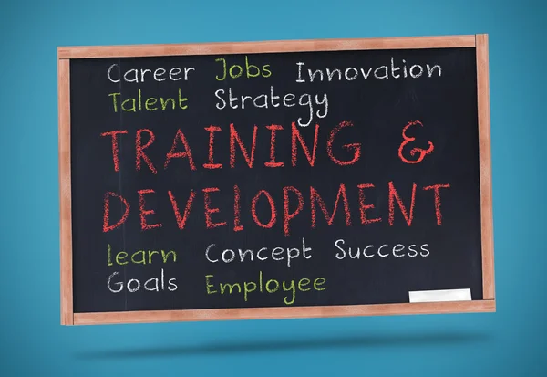 Training and development terms written on a chalkboard — Stock Photo, Image