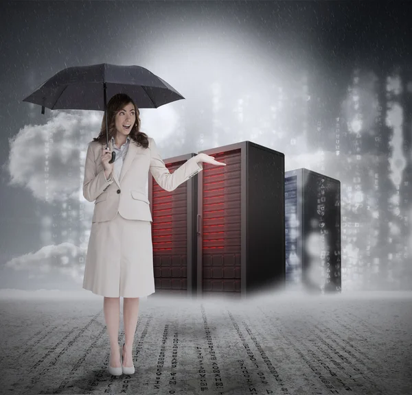 Businesswoman in front of servers holding umbrella — Stock Photo, Image