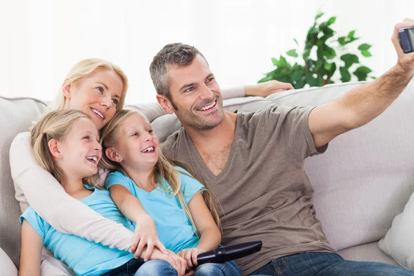 Man taking picture of his children and wife — Stock Photo, Image