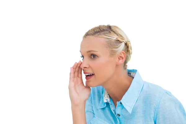 Blonde speaking to someone and looking at something — Stock Photo, Image