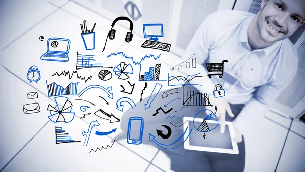 Happy man sitting next to a drawing of charts — Stock Photo, Image