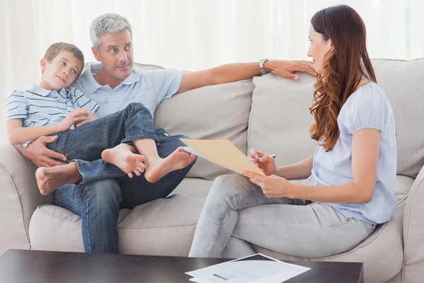 Parents with their son sitting on sofa — Stock Photo, Image