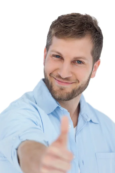 Enthusiastic young model posing with thumbs up — Stock Photo, Image