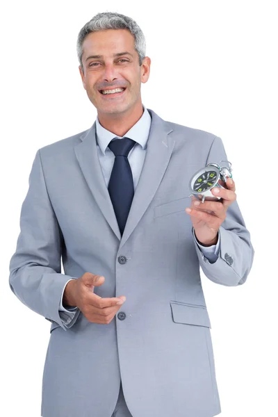 Cheerful businessman holding alarm clock — Stock Photo, Image