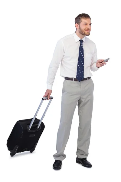 Thoughtful businessman holding phone — Stock Photo, Image