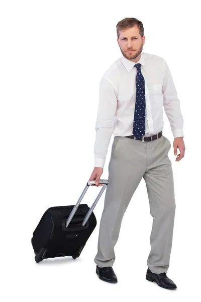 Serious businessman with suitcase — Stock Photo, Image