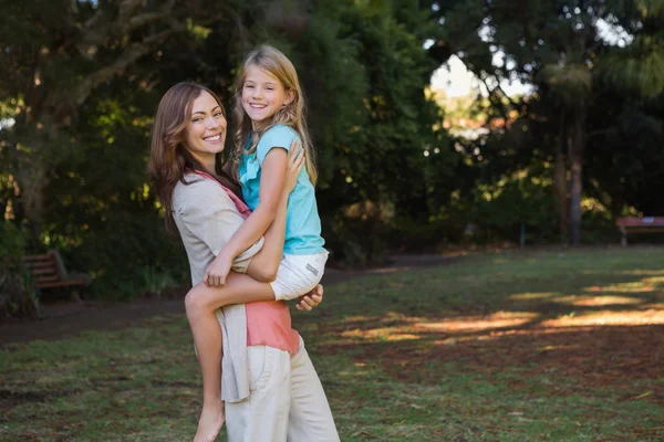 Mother holding her daughter — Stock Photo, Image