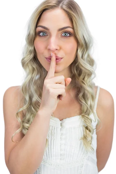 Attractive blonde hiding secret — Stock Photo, Image