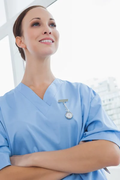 Smiling surgeon posing looking away — Stock Photo, Image