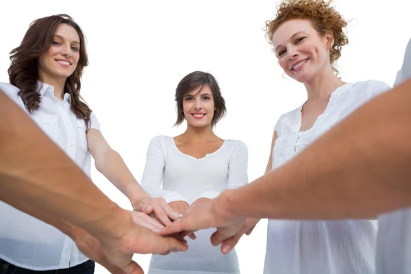 Cheerful models joining hands in a circle — Stock Photo, Image