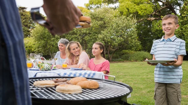Little boy waiting for barbecue cooked by father — Stock Photo, Image
