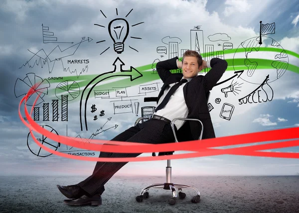 Businessman sitting in front of detailed success brainstorm — Stock Photo, Image