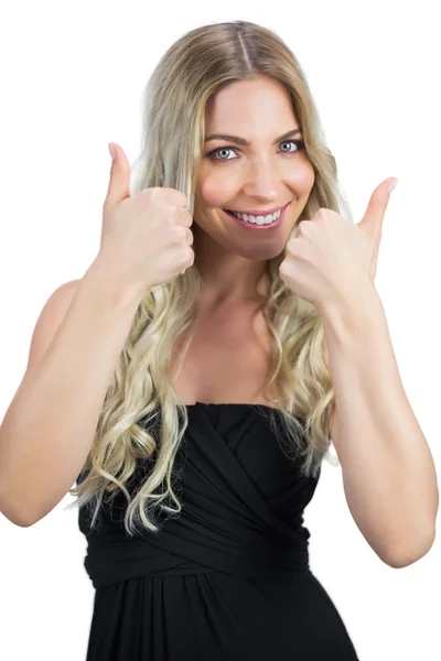 Gorgeous blonde in black dress thumbs up — Stock Photo, Image