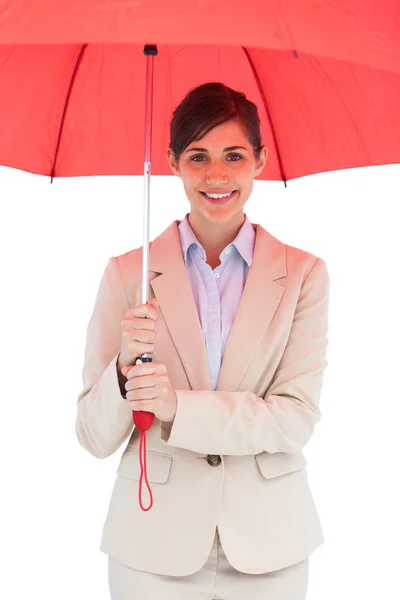 Cheerful young businesswoman with red umbrella — Stock Photo, Image