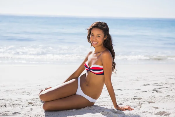 Sexy tanned woman in bikini smiling at camera — Stock Photo, Image