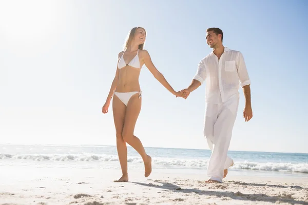 Pretty blonde walking away from man holding her hand — Stock Photo, Image