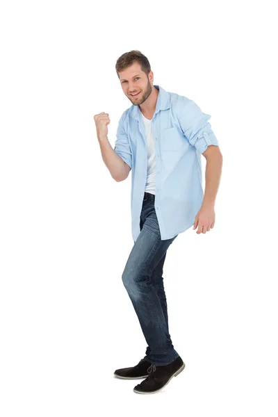 Handsome man posing with clenched fist — Stock Photo, Image