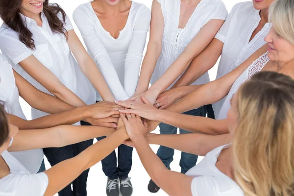 Female models joining hands in a circle — Stock Photo, Image