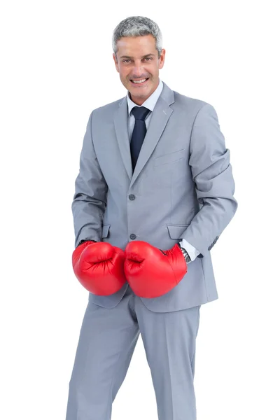 Cool businessman posing with boxing gloves — Stock Photo, Image