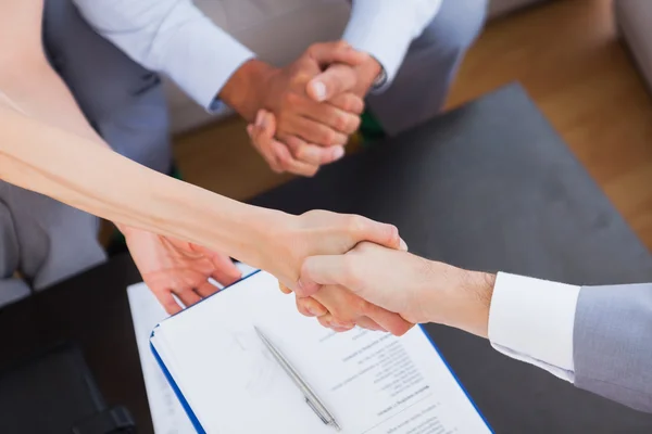 Salesman shaking hand with client — Stock Photo, Image