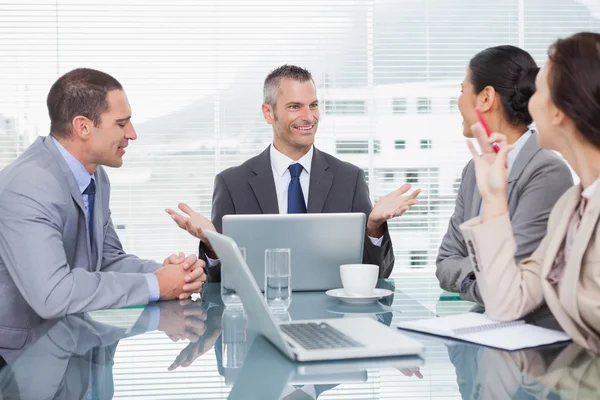 Smiling business people working together over coffee — Stock Photo, Image