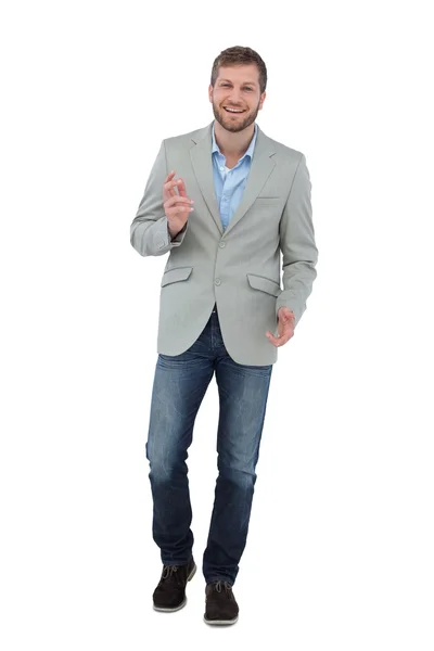 Stylish man smiling and gesturing at the camera — Stock Photo, Image