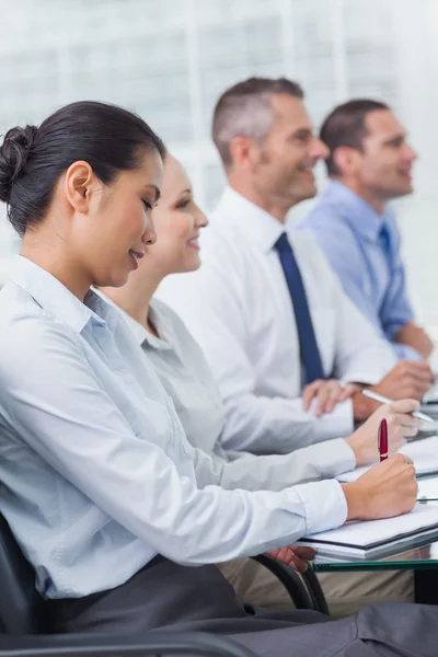 Cheerful employees attending presentation — Stock Photo, Image