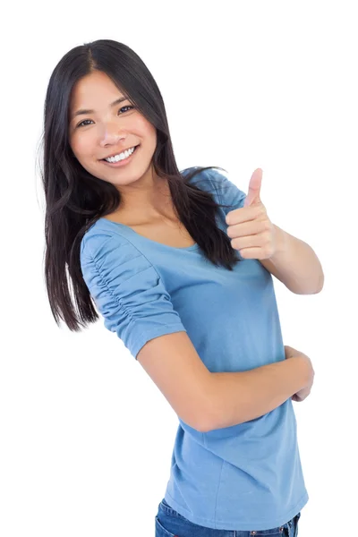 Happy asian woman giving thumb up at camera — Stock Photo, Image