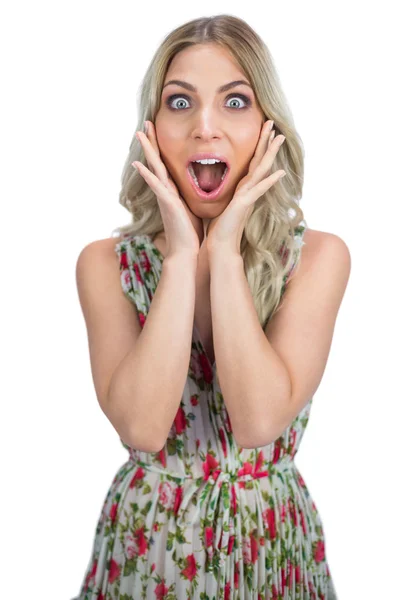 Surprised pretty blonde wearing flowered dress posing — Stock Photo, Image