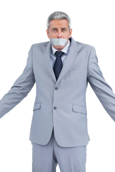 Uomo d'affari con nastro adesivo sulla bocca — Foto Stock