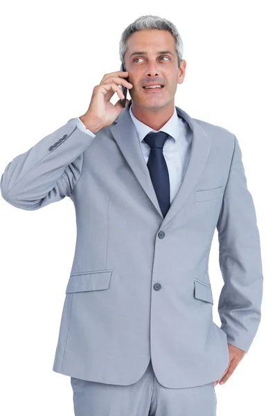 Businessman answering phone — Stock Photo, Image