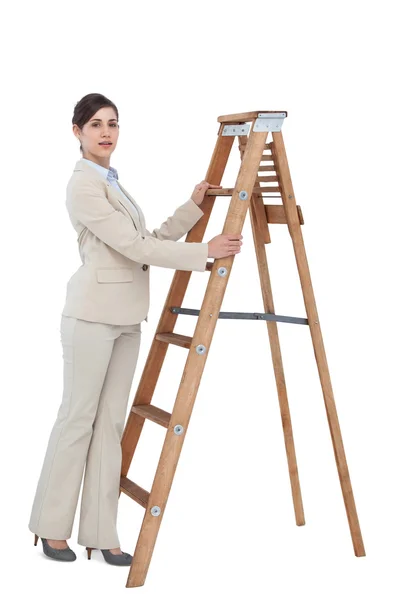 Businesswoman at the bottom of the career ladder — Stock Photo, Image