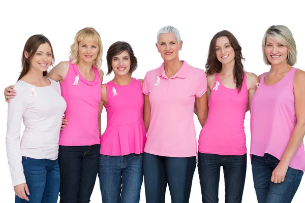 Happy female models joining hands in a circle and looking at cam — Stock Photo, Image