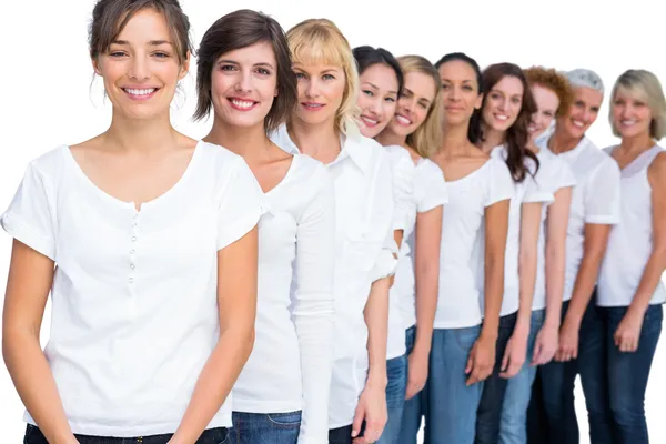 Cheerful models posing in a line — Stock Photo, Image