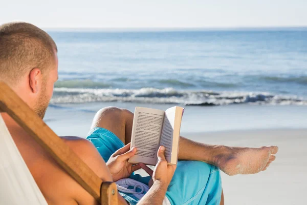 Handsome man reading a book — Stock Photo, Image