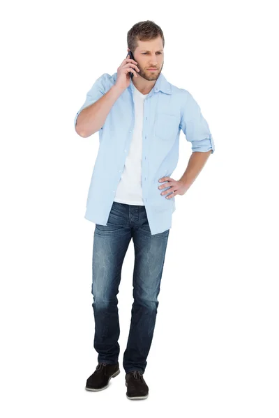 Serious model posing while having a phone call — Stock Photo, Image